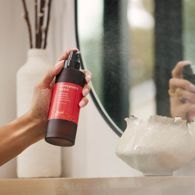 Person spray peppermint twist room spray