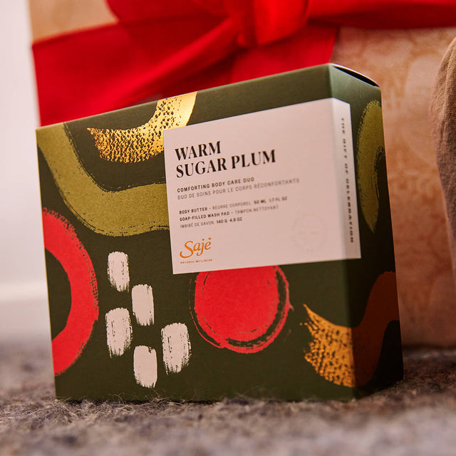 Warm Sugar Plum kit in packaging next to a wrapped present