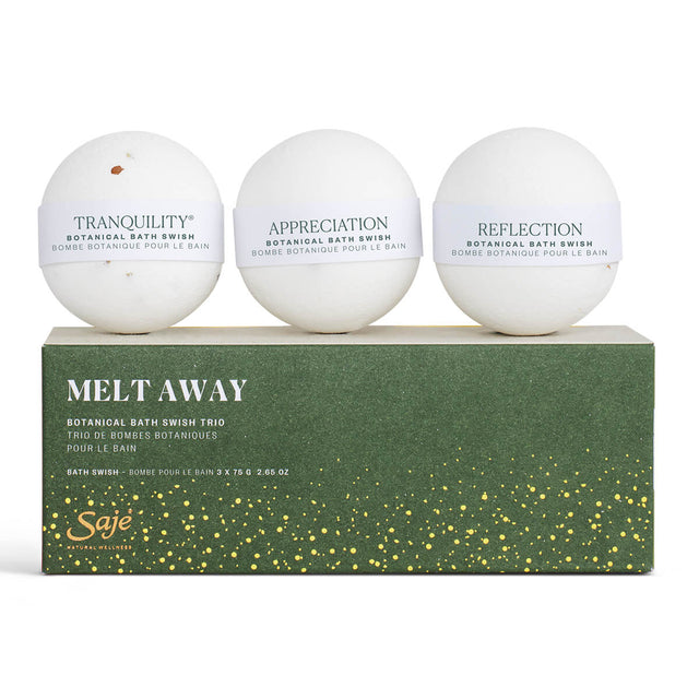 Three botanical bath swishes on top of packaging