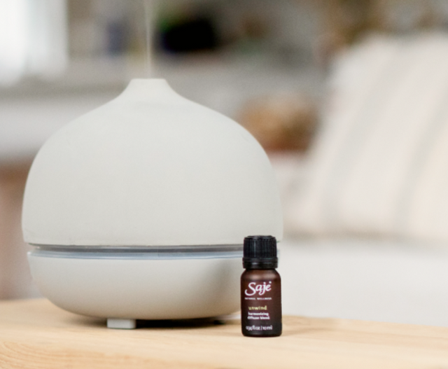 grey diffuser on table with a diffuser blend
