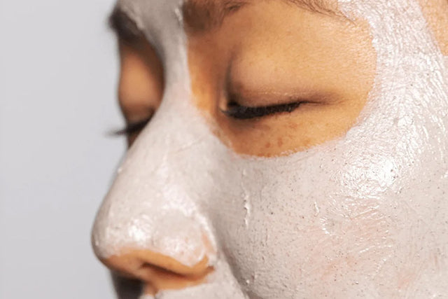 women with face mask against a white background