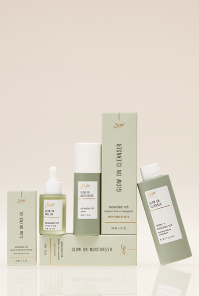 A Saje Glow On skincare collection featuring a cleanser, moisturizer and face oil.