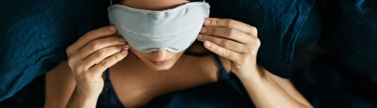 A woman with a sleeping mask on