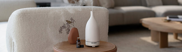 Aroma Om Diffuser on couch side table