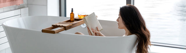 A woman in the bathtub reading her checklist