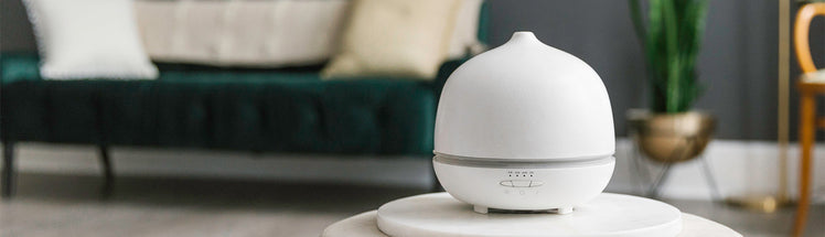 Aroma Om Deluxe diffuser sitting on a table