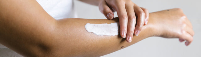 Saje body lotion being applied to a person's arm
