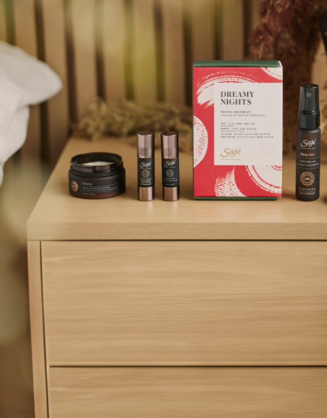 Dreamy Nights Kit laid out on a wood nightstand.