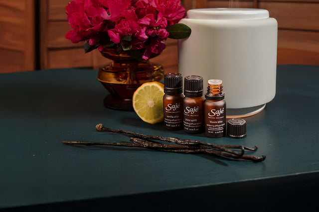 dropping essential oil from a diffuser blend in a diffuser