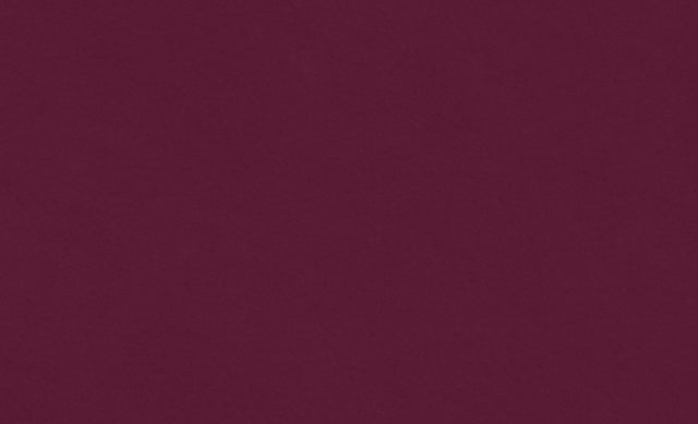 A person hands a Saje remedy roll-on to another person as a gift.