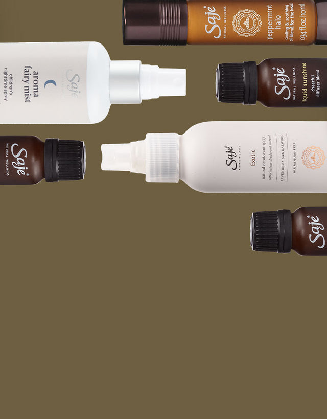 Different 100% natural Saje products stack next to each other on a khaki-coloured background.