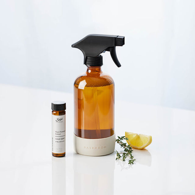 Tea Tree Lemon Kit: spray bottle and refill on white background