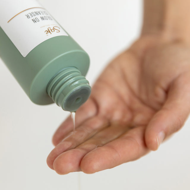 Glow On Cleanser being poured into an open hand