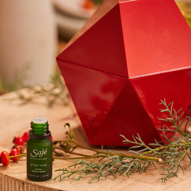 Ginger Snap diffuser blend next to the Aroma Ruby Red diffuser on a festive table