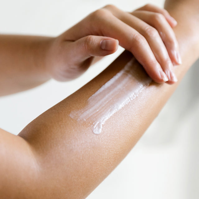 person applying Dreamy Hand Cream on arm
