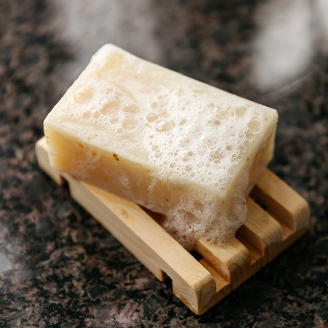 Wet Lemongrass Sass Soap Bar placed on soap holder 