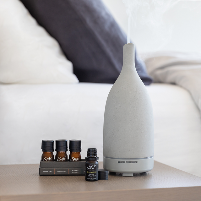 Sweet dreams diffuser blend collection placed beside Aroma Om Diffuser 